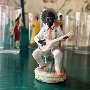German All Bisque Figurine of Black man African Americana playing banjo